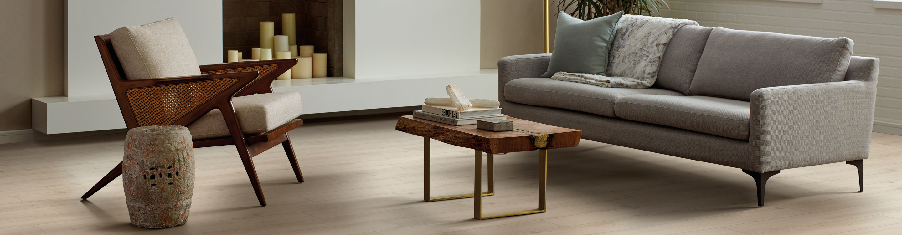 luxury vinyl plank in living room with grey sofa