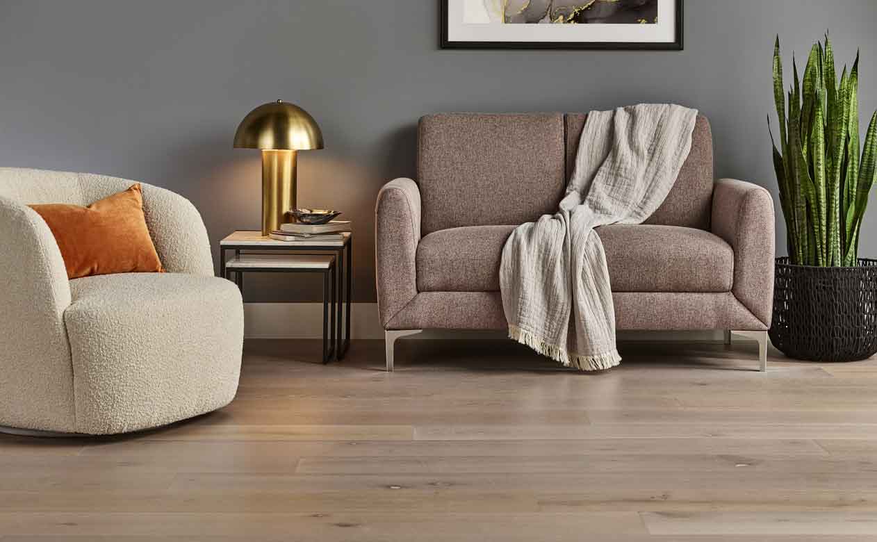 light hardwood flooring in living room with plush furniture